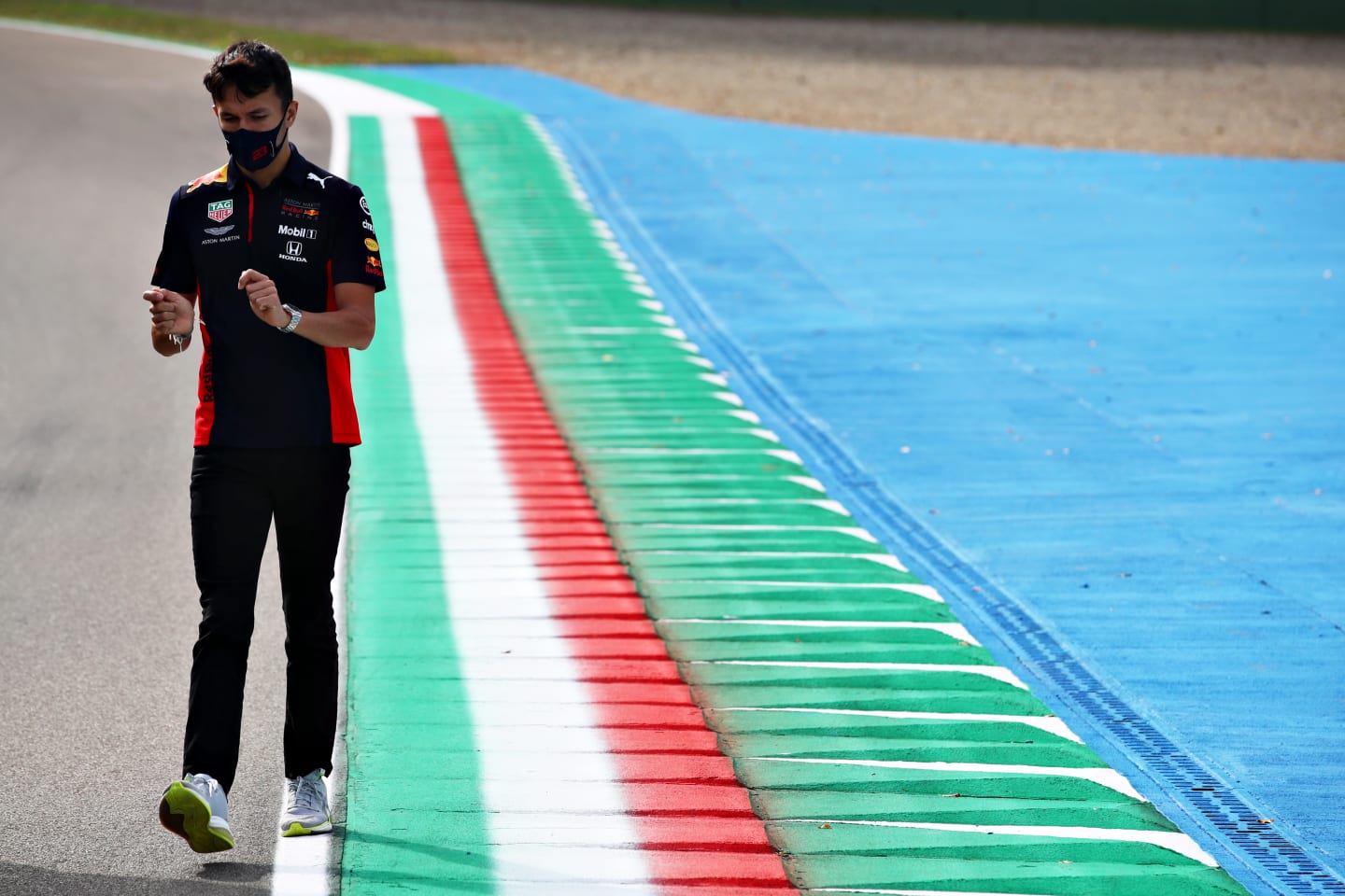IMOLA, ITALY - OCTOBER 30: Alexander Albon of Thailand and Red Bull Racing walks the track during