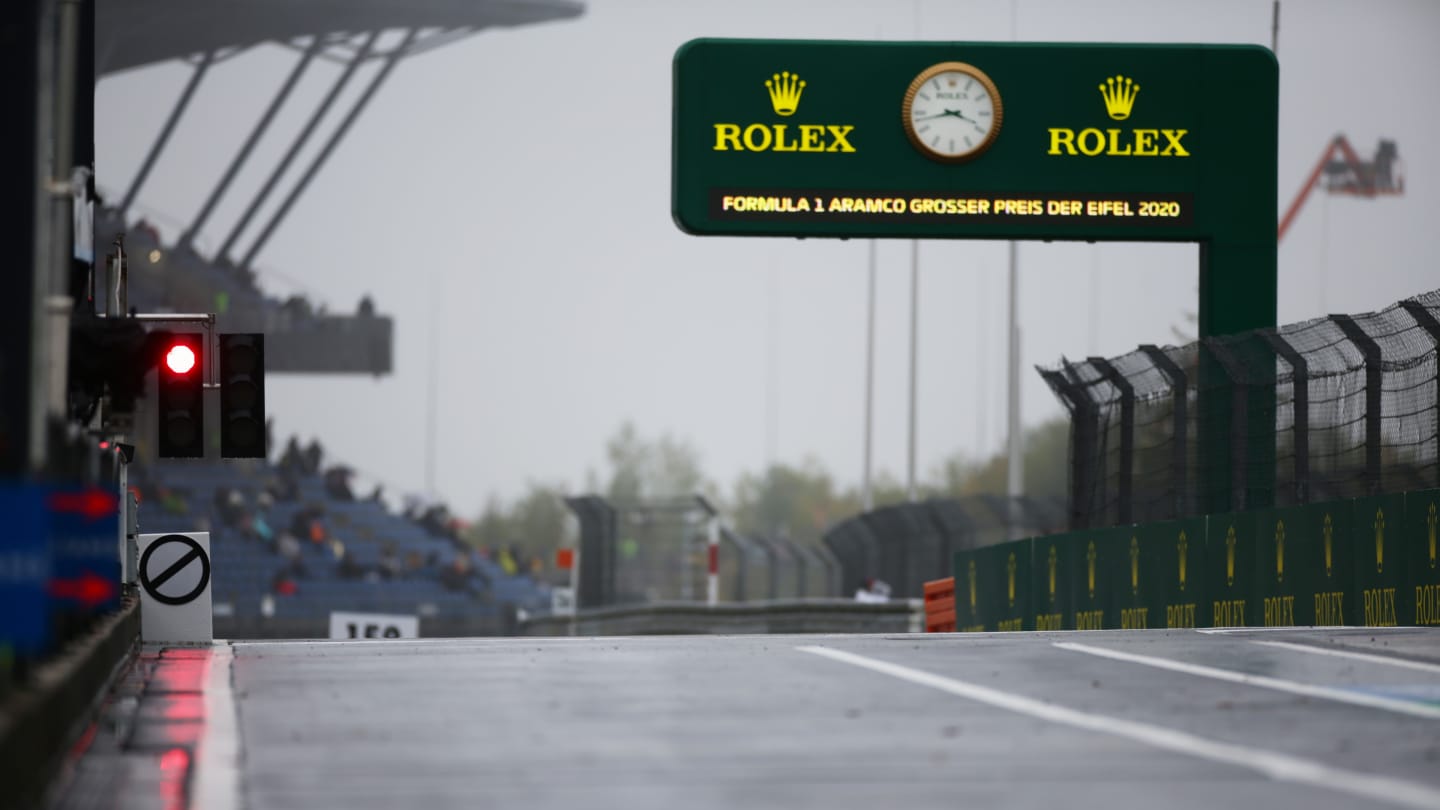 NUERBURG, GERMANY - OCTOBER 09: The pitlane exit light shows red during a weather delayed FP2