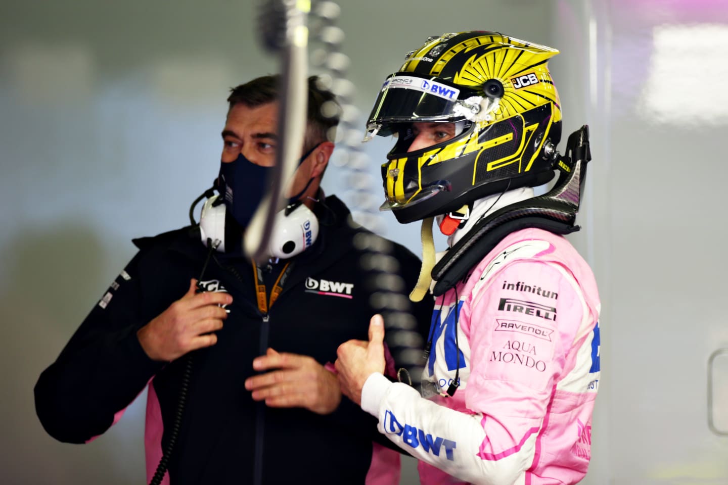 NUERBURG, GERMANY - OCTOBER 10: Nico Hulkenberg of Germany and Racing Point talks with a Racing