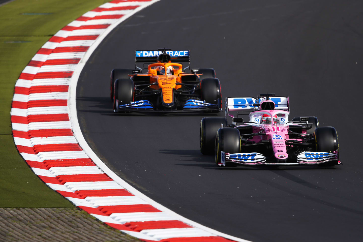 NUERBURG, GERMANY - OCTOBER 10: Sergio Perez of Mexico driving the (11) Racing Point RP20 Mercedes leads Carlos Sainz of Spain driving the (55) McLaren F1 Team MCL35 Renault during qualifying ahead of the F1 Eifel Grand Prix at Nuerburgring on October 10, 2020 in Nuerburg, Germany. (Photo by Bryn Lennon/Getty Images)