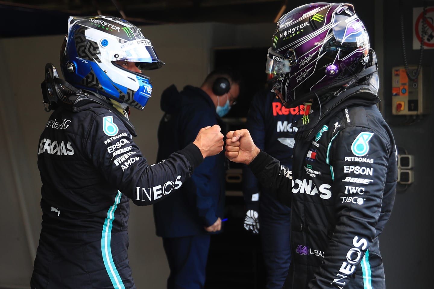NUERBURG, GERMANY - OCTOBER 10: Second placed qualifier Lewis Hamilton of Great Britain and Mercedes GP and pole position qualifier Valtteri Bottas of Finland and Mercedes GP embrace in parc ferme during qualifying ahead of the F1 Eifel Grand Prix at Nuerburgring on October 10, 2020 in Nuerburg, Germany. (Photo by Wolfgang Rattay - Pool/Getty Images)