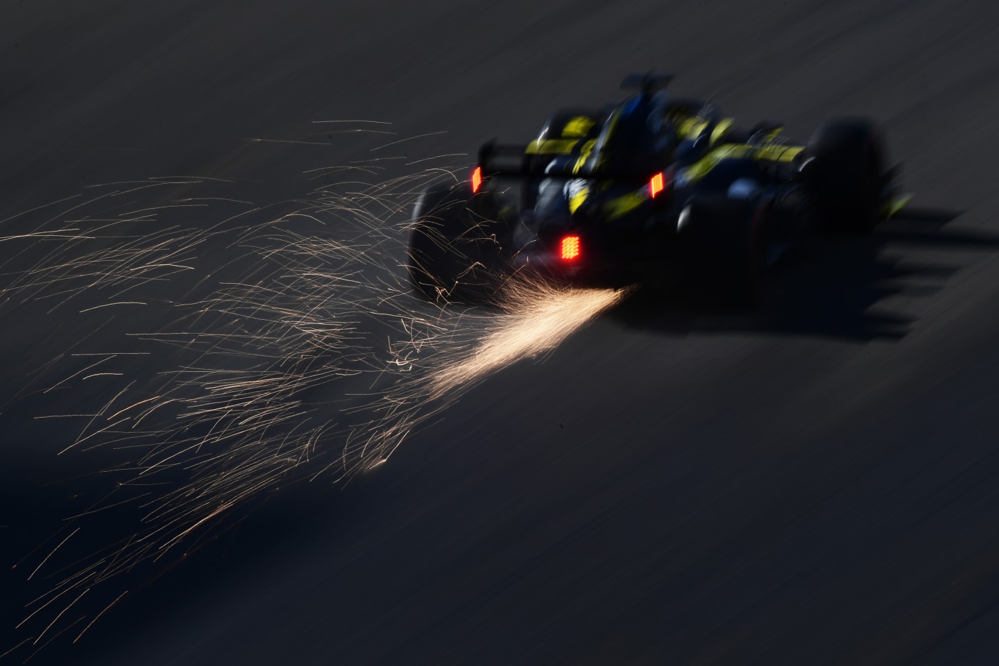 NUERBURG, GERMANY - OCTOBER 10: Sparks fly behind Daniel Ricciardo of Australia driving the (3)