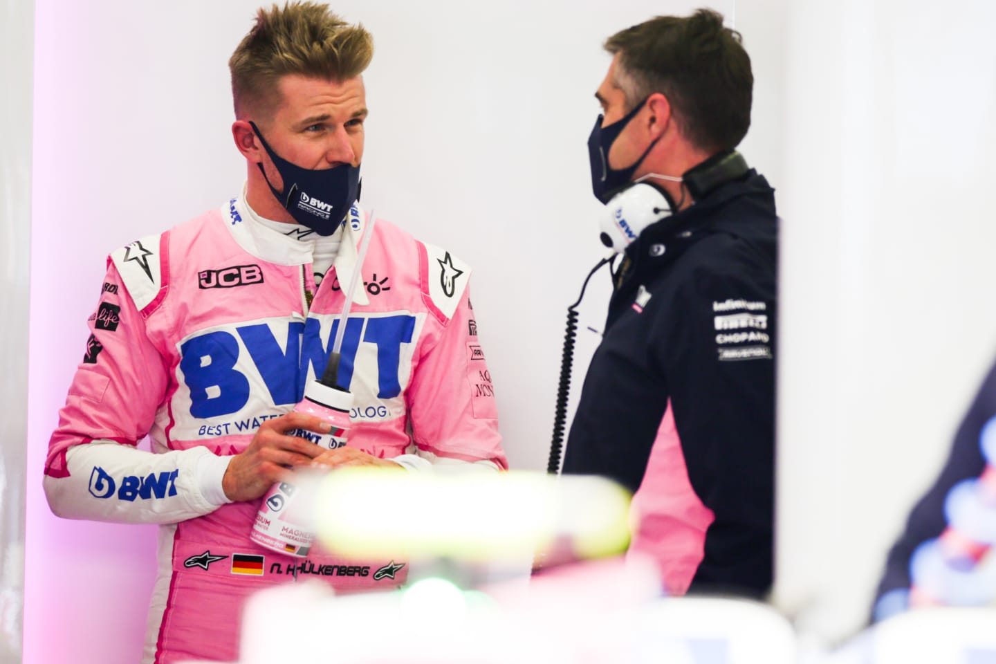 NUERBURG, GERMANY - OCTOBER 10: Nico Hulkenberg of Germany and Racing Point chats with his engineer