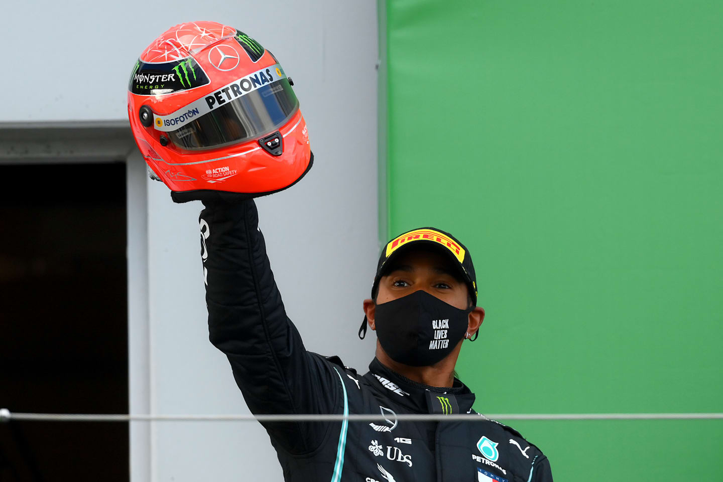 NUERBURG, GERMANY - OCTOBER 11: Race winner Lewis Hamilton of Great Britain and Mercedes GP celebrates after being presented with a helmet of Michael Schumacher for matching his record of 91 race wins during the F1 Eifel Grand Prix at Nuerburgring on October 11, 2020 in Nuerburg, Germany. (Photo by Clive Mason - Formula 1/Formula 1 via Getty Images)