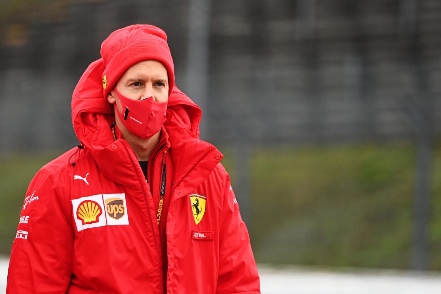 NUERBURG, GERMANY - OCTOBER 08: Sebastian Vettel of Germany and Ferrari walks the track during