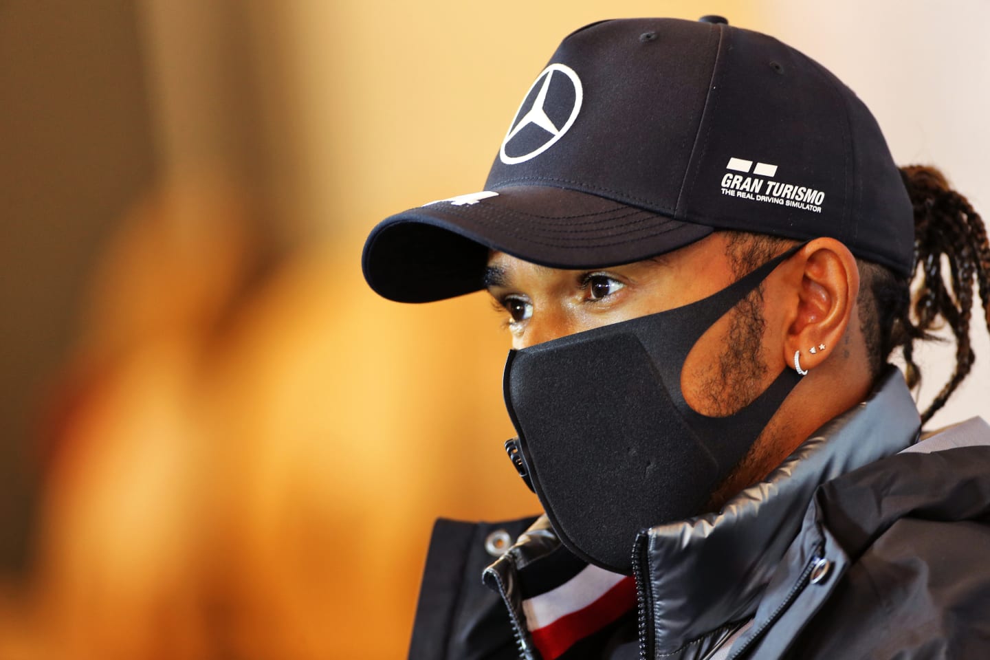 NUERBURG, GERMANY - OCTOBER 08: Lewis Hamilton of Great Britain and Mercedes GP talks in the