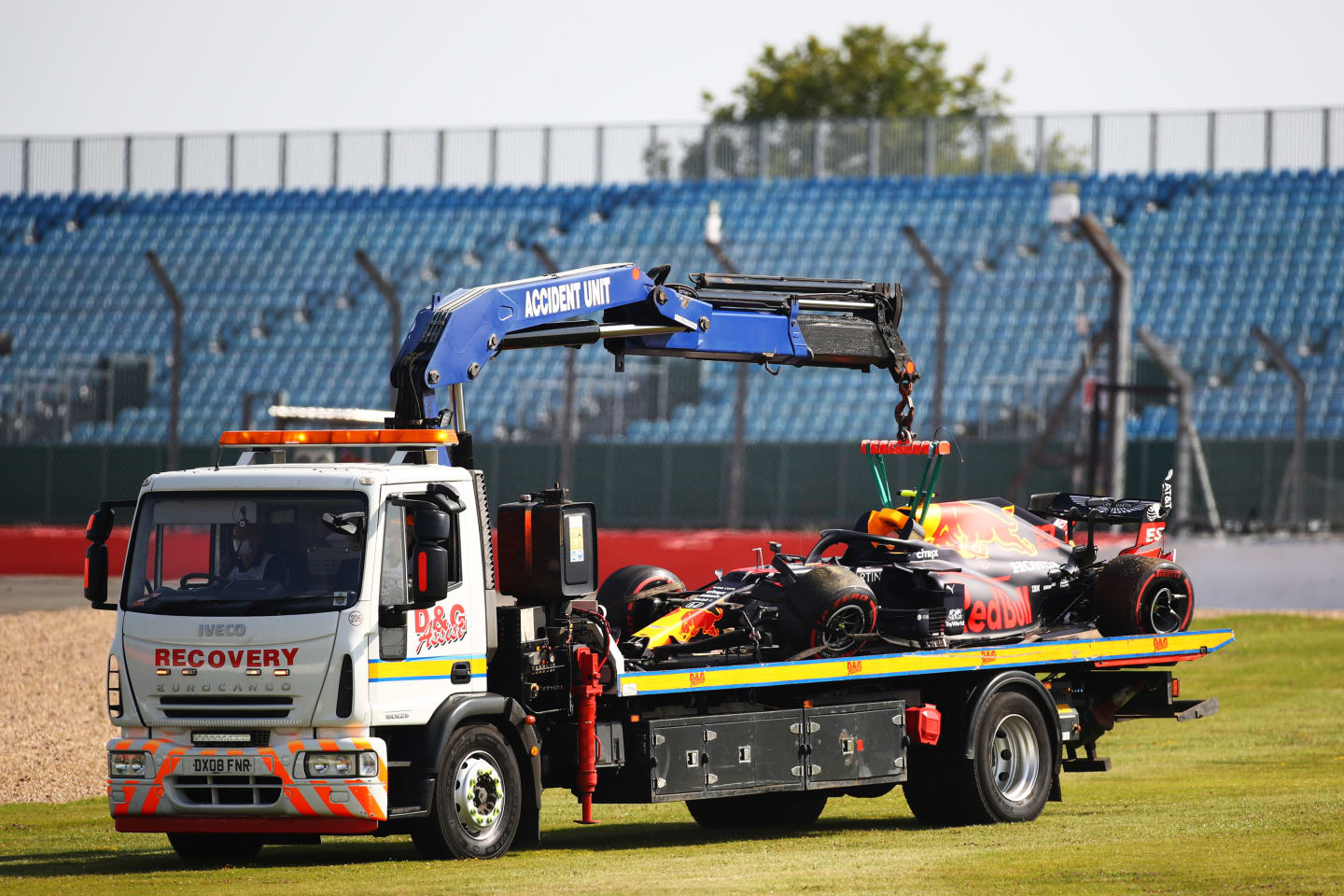 NORTHAMPTON, ENGLAND - JULY 31: The car of Alexander Albon of Thailand and Red Bull Racing is transported back to the pits on a recovery truck after crashing into a track barrier during practice for the F1 Grand Prix of Great Britain at Silverstone on July 31, 2020 in Northampton, England. (Photo by Bryn Lennon/Getty Images)