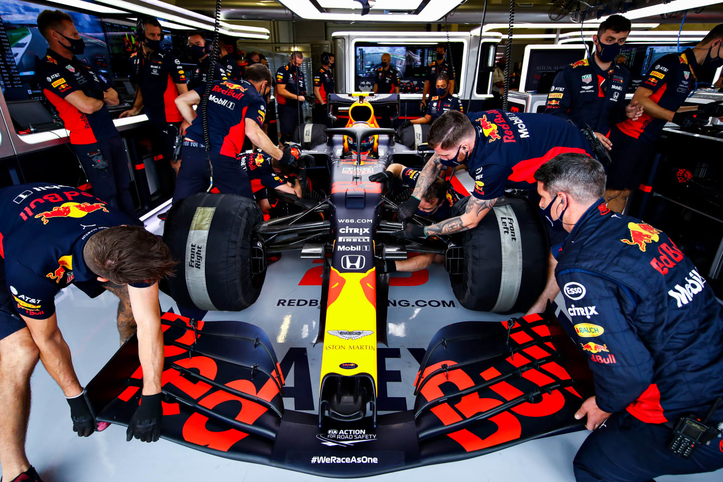 NORTHAMPTON, ENGLAND - AUGUST 01: The Red Bull Racing team work on the car of Alexander Albon of Thailand and Red Bull Racing in the garage during final practice for the F1 Grand Prix of Great Britain at Silverstone on August 01, 2020 in Northampton, England. (Photo by Mark Thompson/Getty Images)