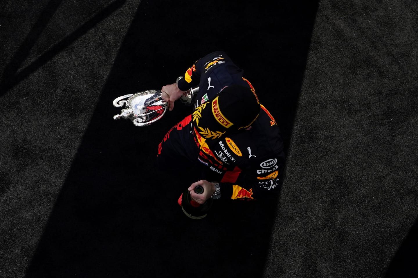 NORTHAMPTON, ENGLAND - AUGUST 02: Runner-up Max Verstappen of Netherlands and Red Bull Racing celebrates on the podium during the F1 Grand Prix of Great Britain at Silverstone on August 02, 2020 in Northampton, England. (Photo by Will Oliver/Pool via Getty Images)
