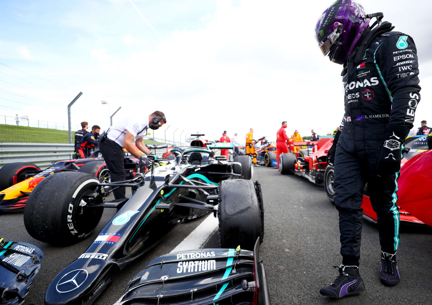 NORTHAMPTON, ENGLAND - AUGUST 02: Lewis Hamilton of Great Britain and Mercedes GP inspects his punctured tyre in parc ferme after the Formula One Grand Prix of Hungary at Silverstone on August 02, 2020 in Northampton, England. (Photo by Dan Istitene - Formula 1/Formula 1 via Getty Images)