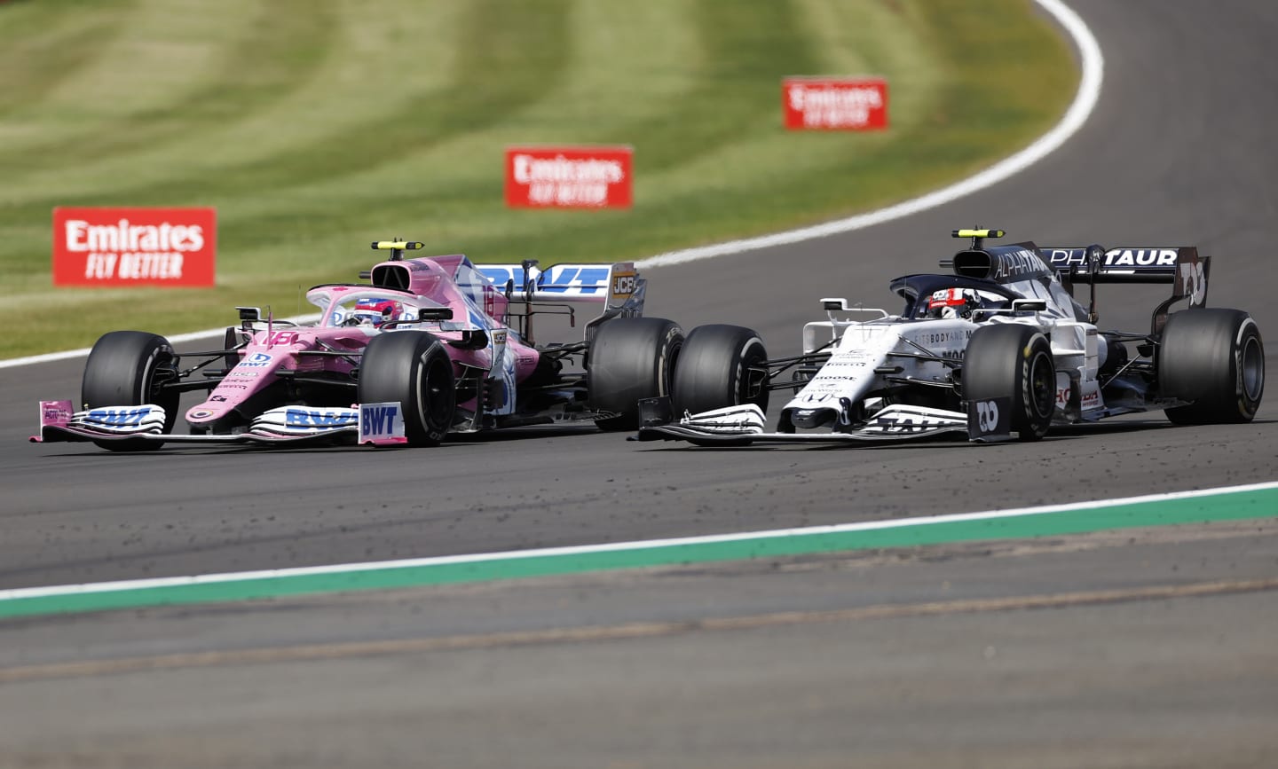 NORTHAMPTON, ENGLAND - AUGUST 02: Lance Stroll of Canada driving the (18) Racing Point RP20 Mercedes battles for position with Pierre Gasly of France driving the (10) Scuderia AlphaTauri AT01 Honda during the F1 Grand Prix of Great Britain at Silverstone on August 02, 2020 in Northampton, England. (Photo by Andrew Boyers/Pool via Getty Images)