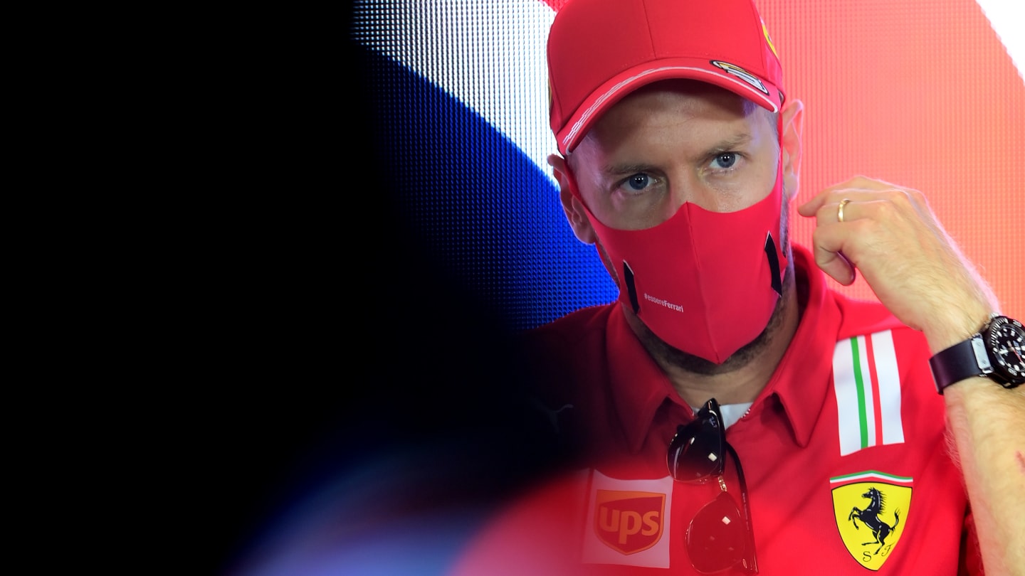 NORTHAMPTON, ENGLAND - JULY 30: Sebastian Vettel of Germany and Ferrari talks in the Drivers Press