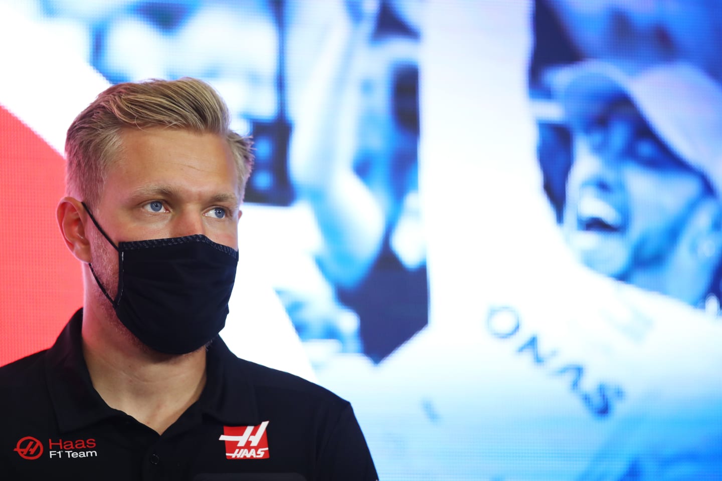NORTHAMPTON, ENGLAND - JULY 30: Kevin Magnussen of Denmark and Haas F1 talks in the Drivers Press