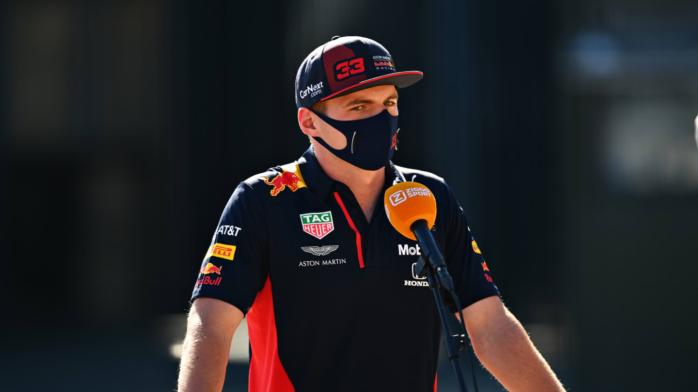 NORTHAMPTON, ENGLAND - JULY 30: Max Verstappen of Netherlands and Red Bull Racing talks to the