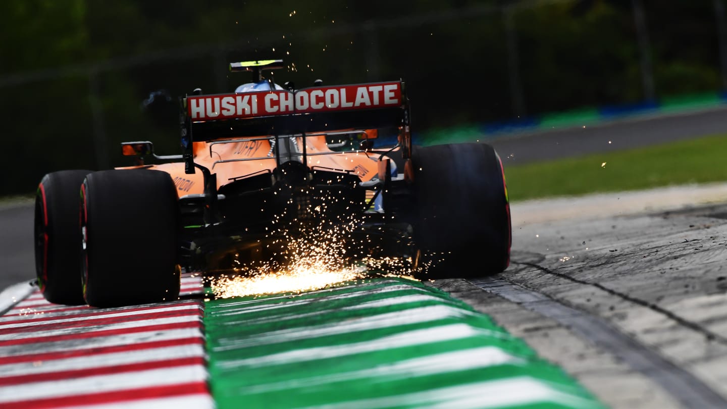 BUDAPEST, HUNGARY - JULY 17: Sparks fly behind Lando Norris of Great Britain driving the (4) McLaren F1 Team MCL35 Renault during practice for the F1 Grand Prix of Hungary at Hungaroring on July 17, 2020 in Budapest, Hungary. (Photo by Mario Renzi - Formula 1/Formula 1 via Getty Images)