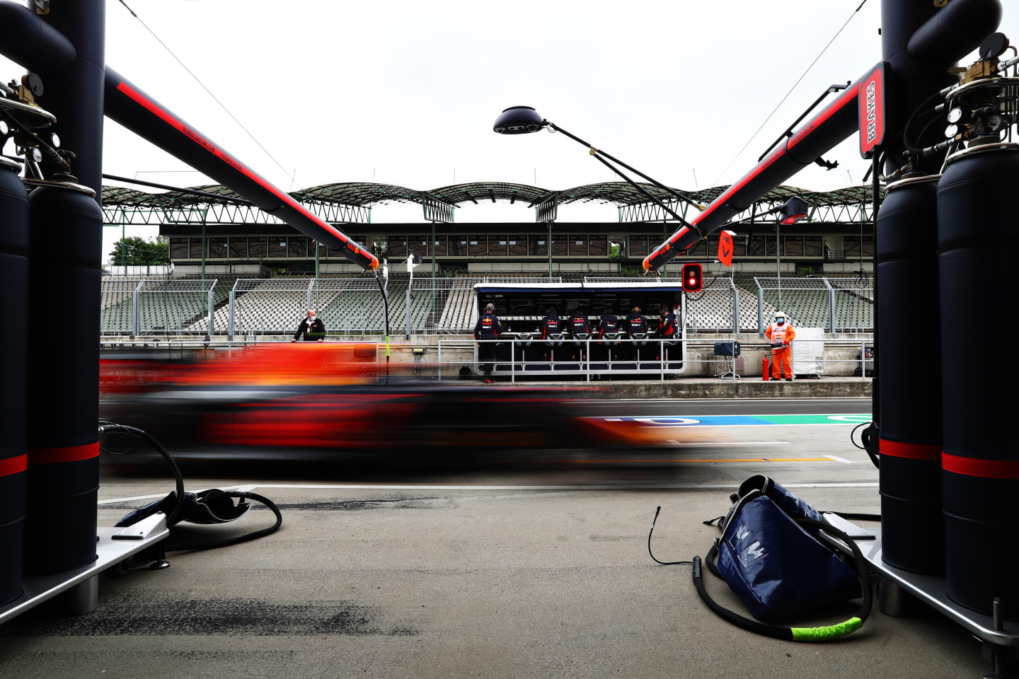 BUDAPEST, HUNGARY - JULY 18: Alexander Albon of Thailand driving the (23) Aston Martin Red Bull Racing RB16 passes his garage during qualifying for the F1 Grand Prix of Hungary at Hungaroring on July 18, 2020 in Budapest, Hungary. (Photo by Getty Images/Getty Images)