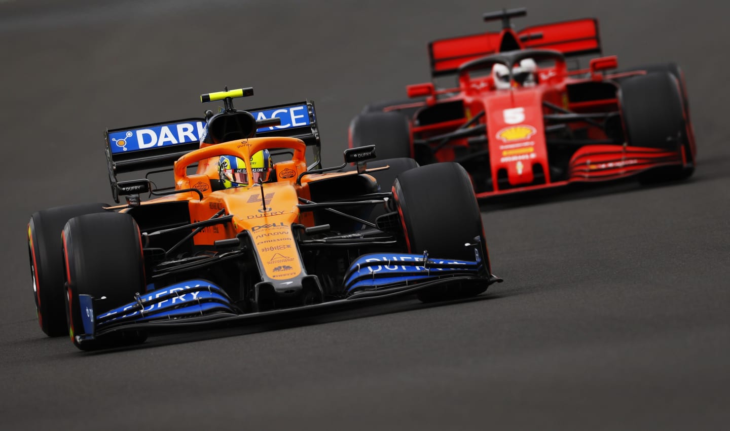 BUDAPEST, HUNGARY - JULY 18: Lando Norris of Great Britain driving the (4) McLaren F1 Team MCL35 Renault leads Sebastian Vettel of Germany driving the (5) Scuderia Ferrari SF1000 during qualifying for the F1 Grand Prix of Hungary at Hungaroring on July 18, 2020 in Budapest, Hungary. (Photo by Leonhard Foeger/Pool via Getty Images)