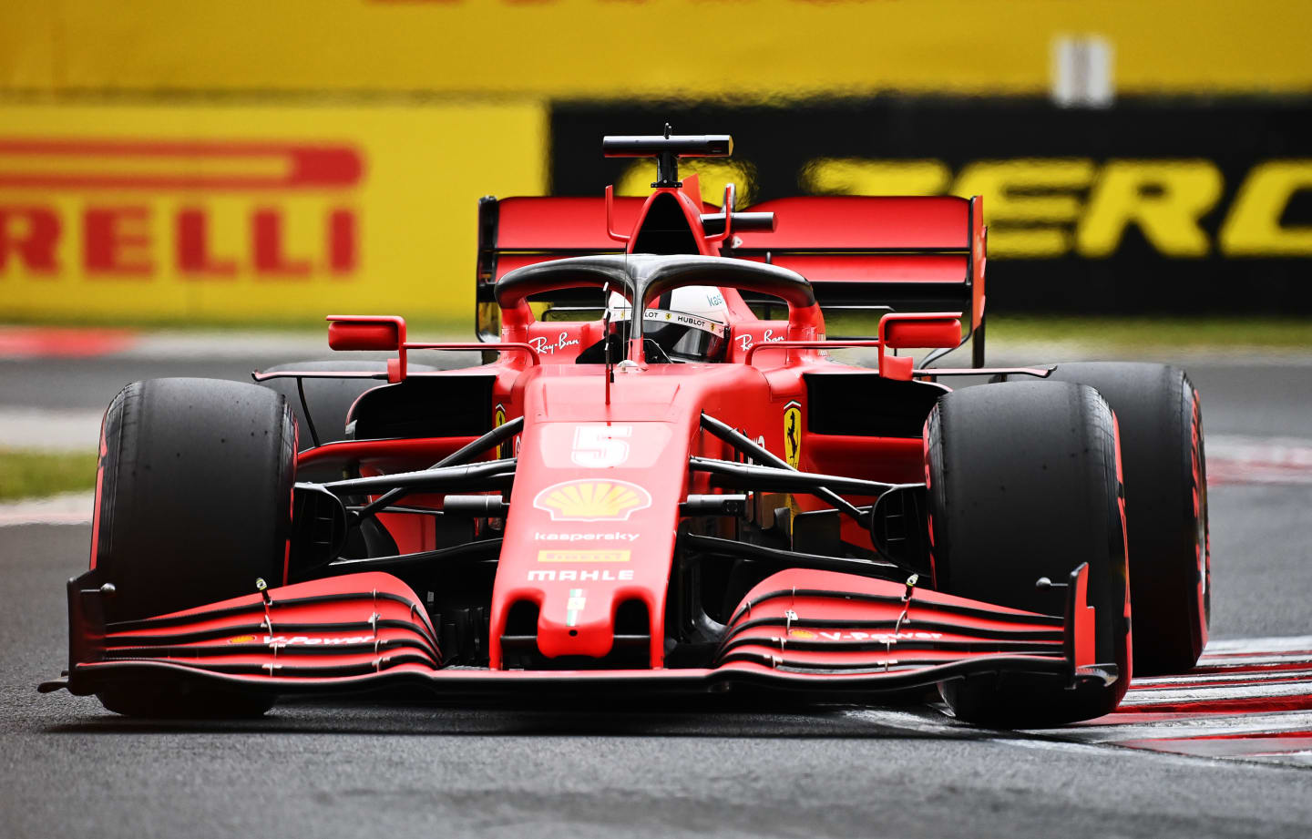 BUDAPEST, HUNGARY - JULY 18: Sebastian Vettel of Germany driving the (5) Scuderia Ferrari SF1000 on