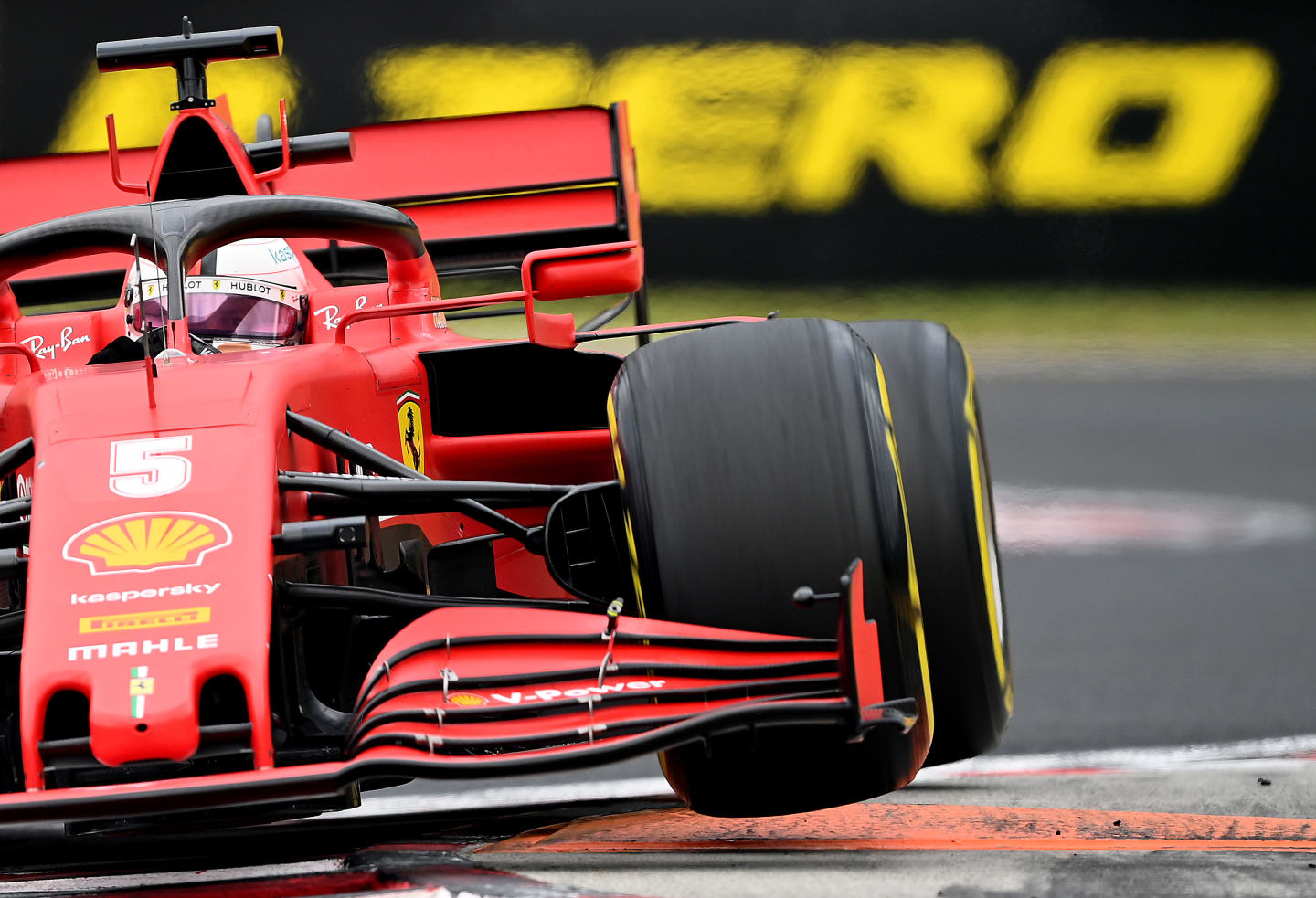 BUDAPEST, HUNGARY - JULY 19: Sebastian Vettel of Germany driving the (5) Scuderia Ferrari SF1000 on