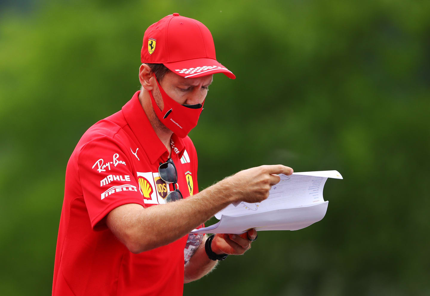 BUDAPEST, HUNGARY - JULY 16: Sebastian Vettel of Germany and Ferrari walks the track during