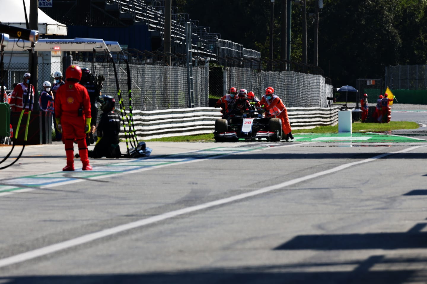 MONZA, ITALY - SEPTEMBER 06: The car of Kevin Magnussen of Denmark and Haas F1 is pushed back into
