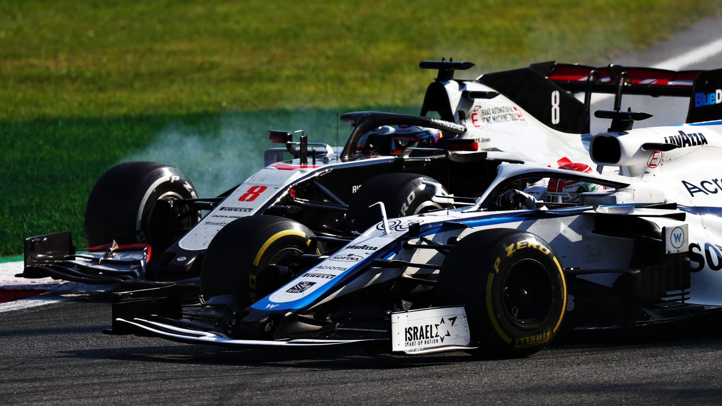 MONZA, ITALY - SEPTEMBER 06: George Russell of Great Britain driving the (63) Williams Racing FW43 Mercedes and Romain Grosjean of France driving the (8) Haas F1 Team VF-20 Ferrari battle for position during the F1 Grand Prix of Italy at Autodromo di Monza on September 06, 2020 in Monza, Italy. (Photo by Dan Istitene - Formula 1/Formula 1 via Getty Images)