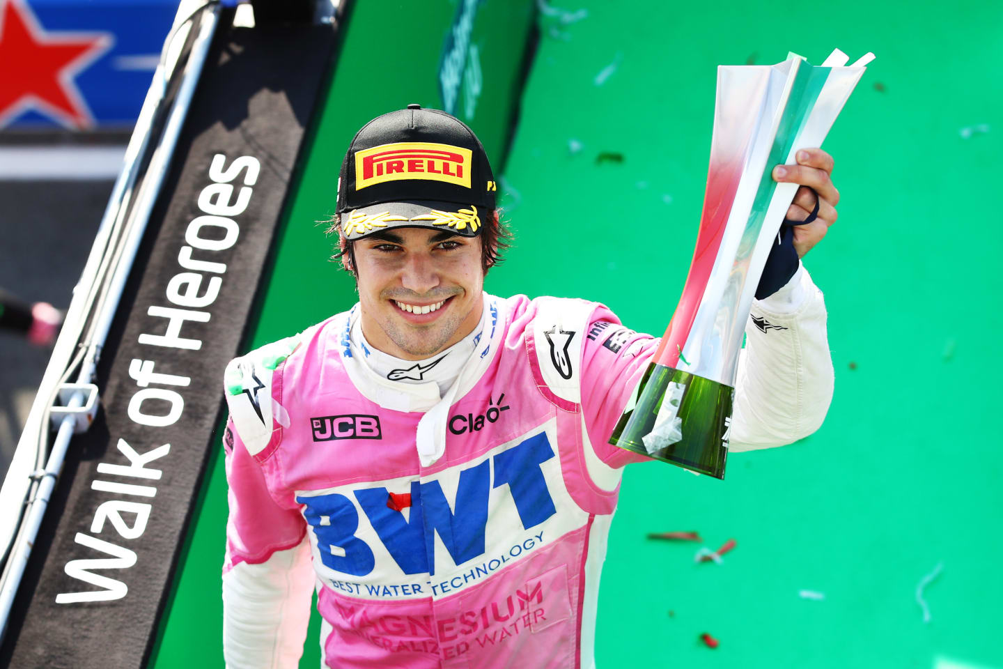 MONZA, ITALY - SEPTEMBER 06: Third placed Lance Stroll of Canada and Racing Point celebrates on the podium during the F1 Grand Prix of Italy at Autodromo di Monza on September 06, 2020 in Monza, Italy. (Photo by Mark Thompson/Getty Images)