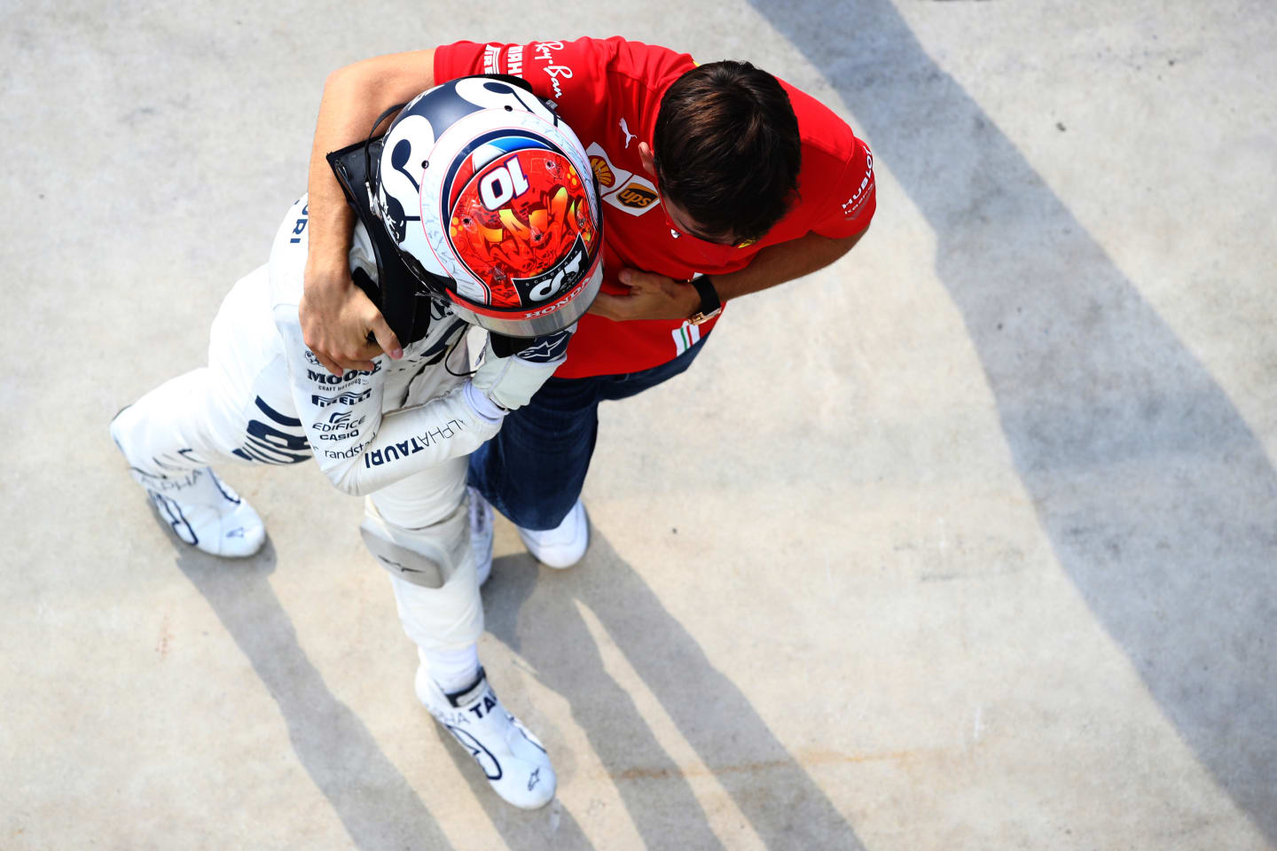 MONZA, ITALY - SEPTEMBER 06: Race winner Pierre Gasly of France and Scuderia AlphaTauri celebrates with Charles Leclerc of Monaco and Ferrari in parc ferme during the F1 Grand Prix of Italy at Autodromo di Monza on September 06, 2020 in Monza, Italy. (Photo by Mark Thompson/Getty Images)