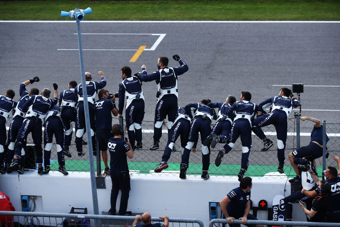 MONZA, ITALY - SEPTEMBER 06: Scuderia AlphaTauri team members celebrate during the F1 Grand Prix of Italy at Autodromo di Monza on September 06, 2020 in Monza, Italy. (Photo by Mark Thompson/Getty Images)