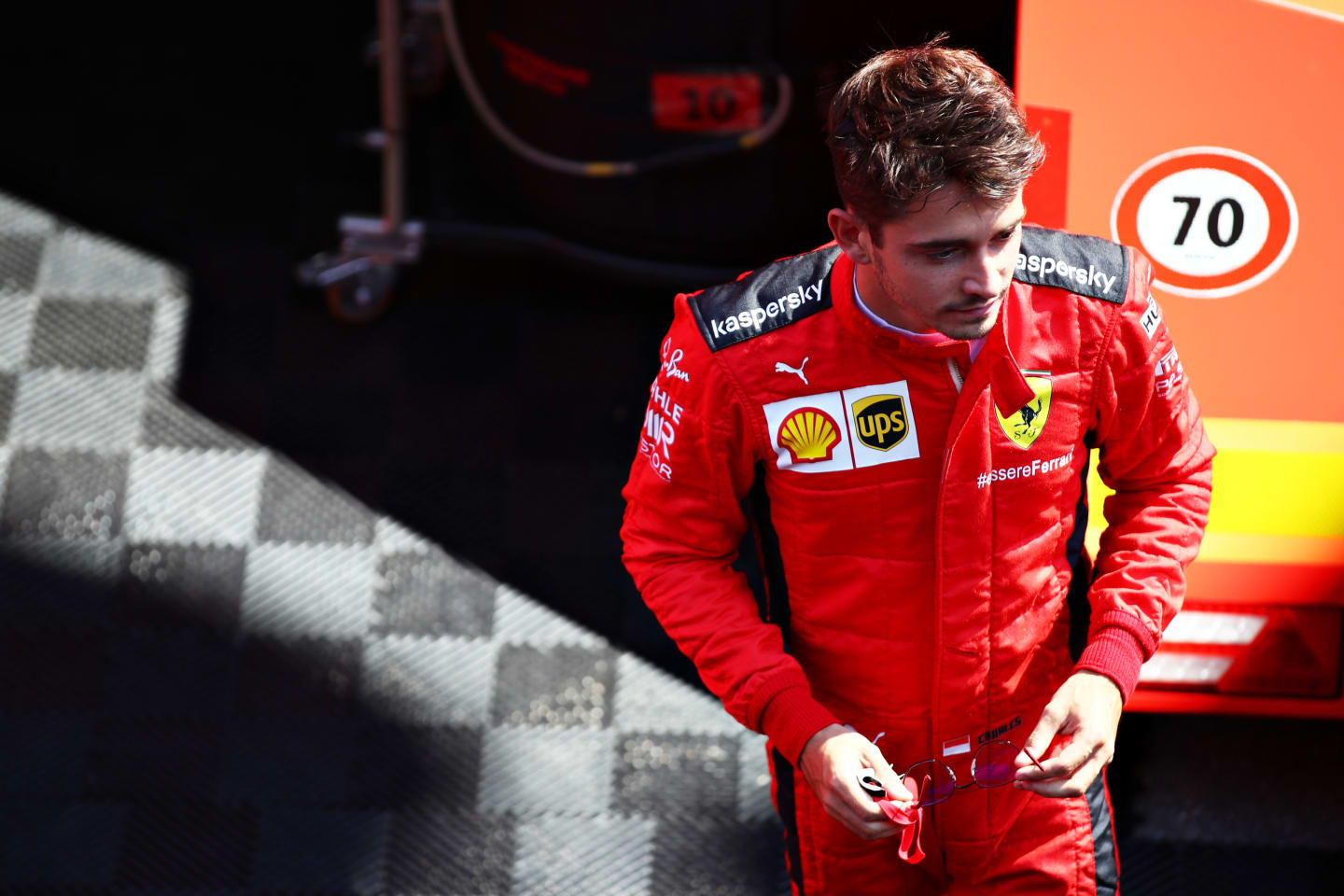 MONZA, ITALY - SEPTEMBER 03: Charles Leclerc of Monaco and Ferrari looks on in the Paddock during