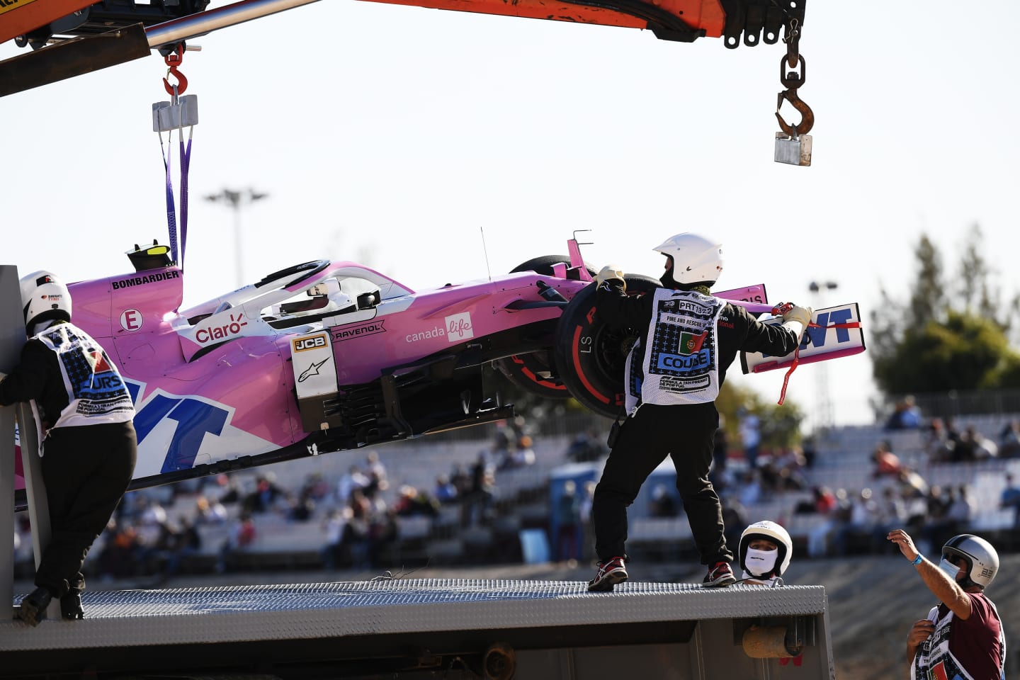 PORTIMAO, PORTUGAL - OCTOBER 23: The car of Lance Stroll of Canada and Racing Point is removed from the track after a crash during practice ahead of the F1 Grand Prix of Portugal at Autodromo Internacional do Algarve on October 23, 2020 in Portimao, Portugal. (Photo by Jorge Guerrero - Pool/Getty Images)