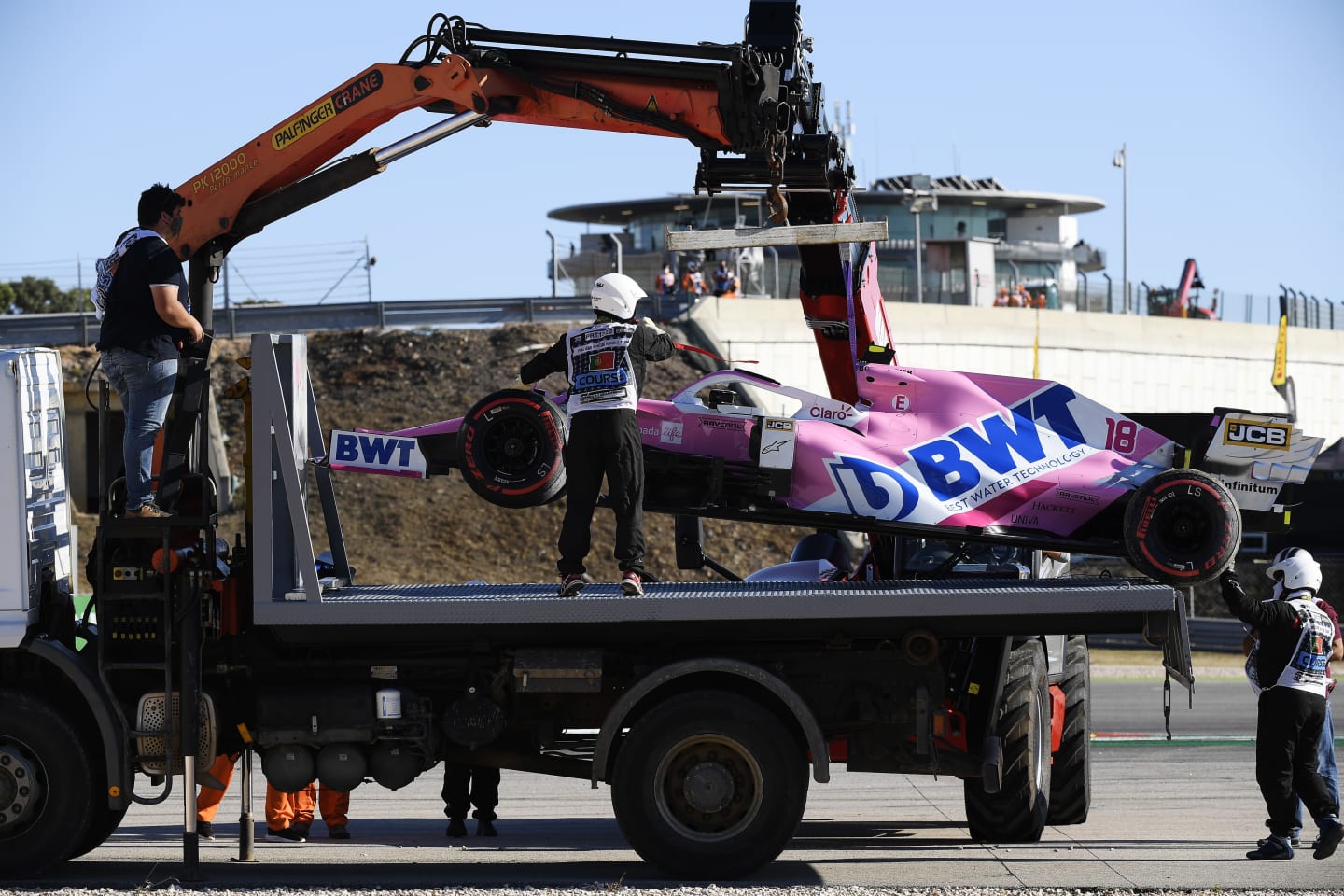 PORTIMAO, PORTUGAL - OCTOBER 23: The car of Lance Stroll of Canada and Racing Point is removed from