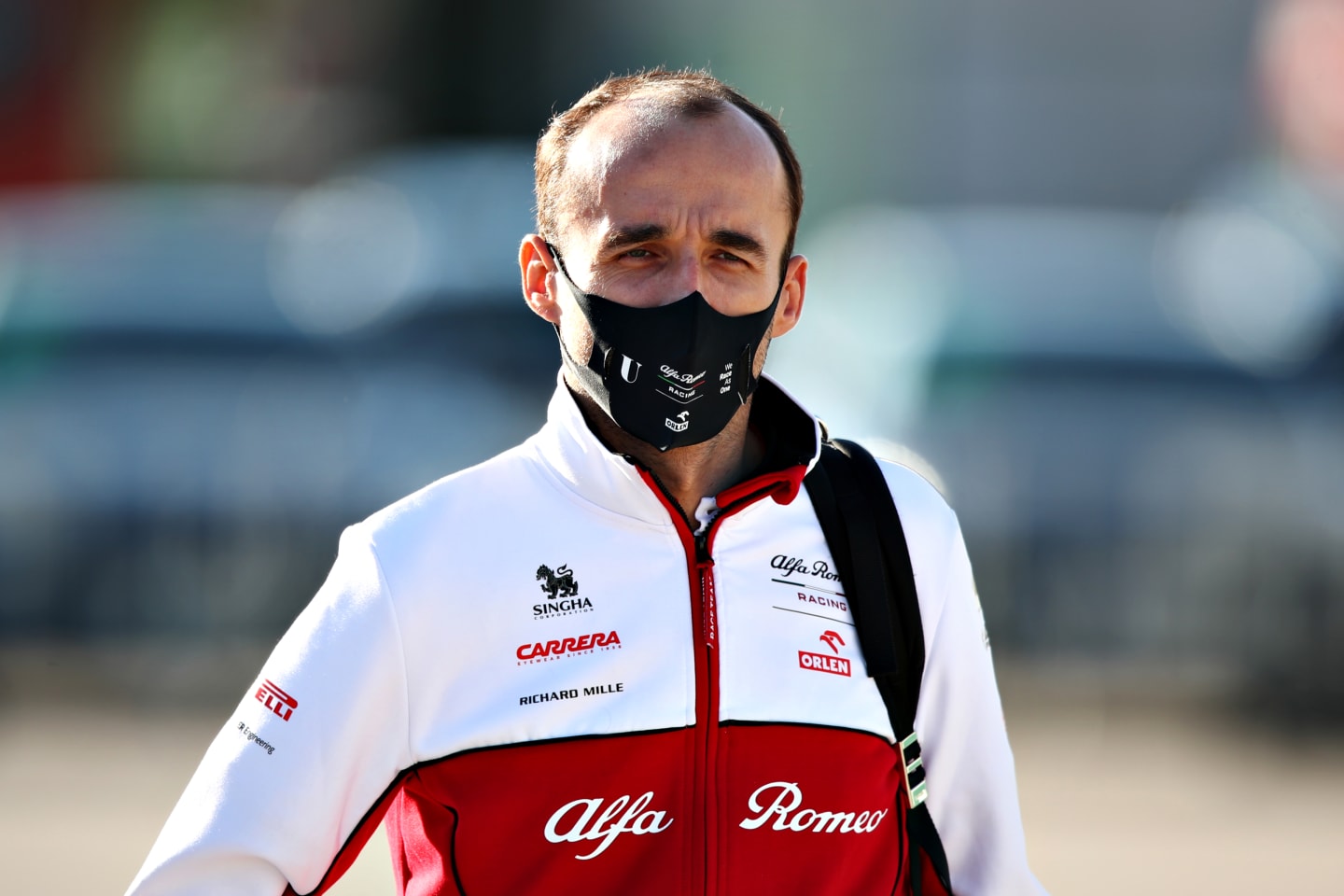 PORTIMAO, PORTUGAL - OCTOBER 24: Robert Kubica of Poland and Alfa Romeo Racing walks in the Paddock