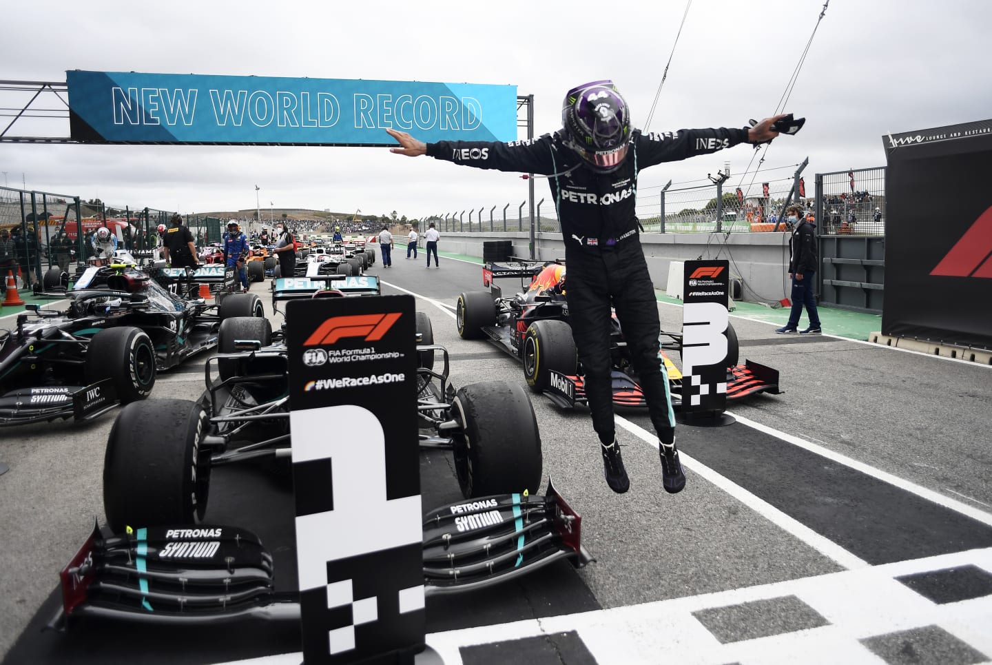 PORTIMAO, PORTUGAL - OCTOBER 25: Race winner Lewis Hamilton of Great Britain and Mercedes GP celebrates his record breaking 92nd race win in parc ferme during the F1 Grand Prix of Portugal at Autodromo Internacional do Algarve on October 25, 2020 in Portimao, Portugal. (Photo by Jorge Guerrero - Pool/Getty Images)