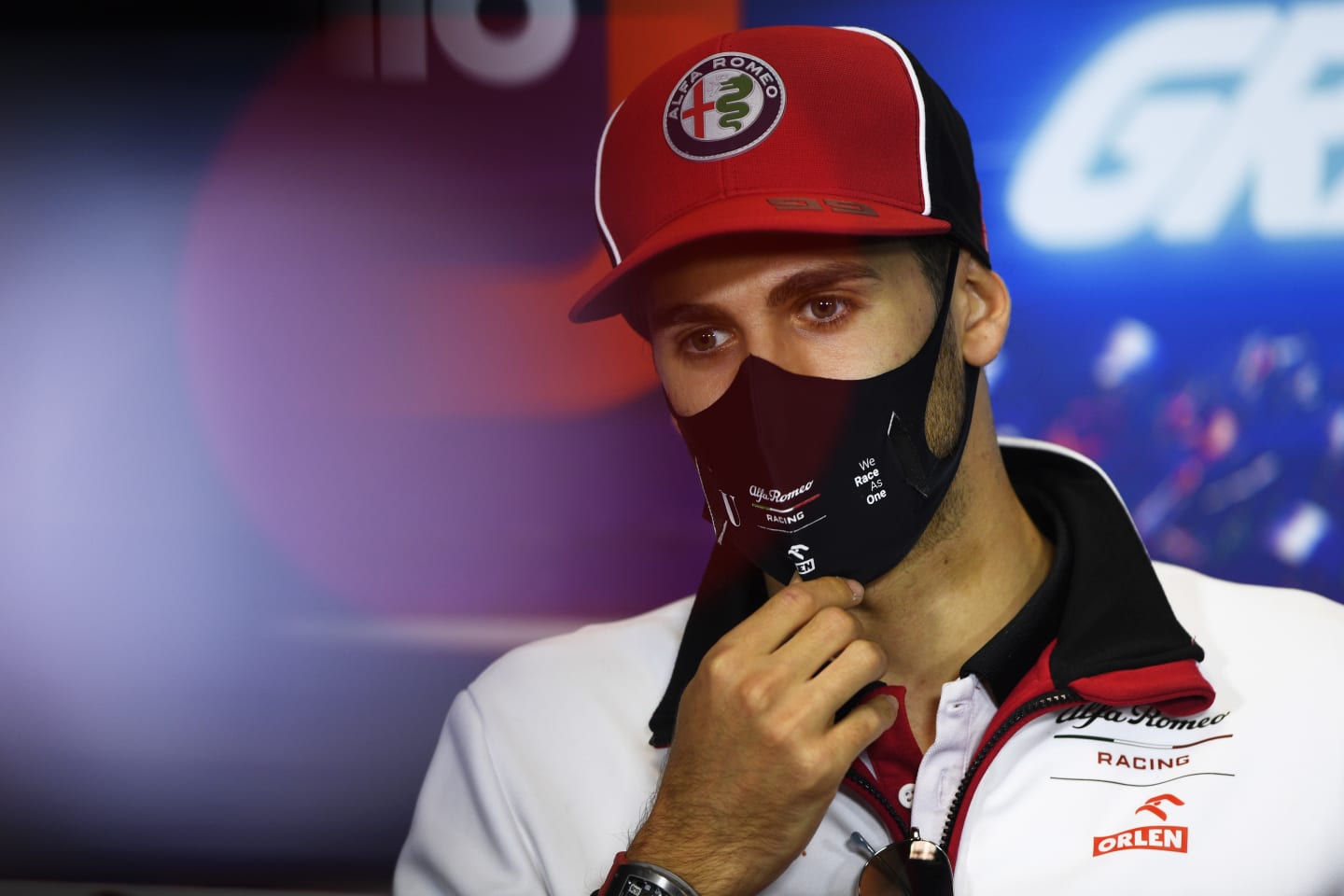 PORTIMAO, PORTUGAL - OCTOBER 22: Antonio Giovinazzi of Italy and Alfa Romeo Racing talks in the