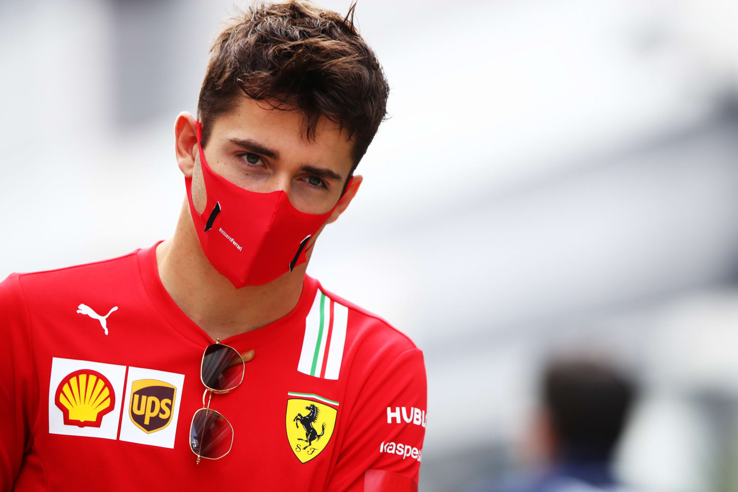SOCHI, RUSSIA - SEPTEMBER 26: Charles Leclerc of Monaco and Ferrari walks in the Paddock before