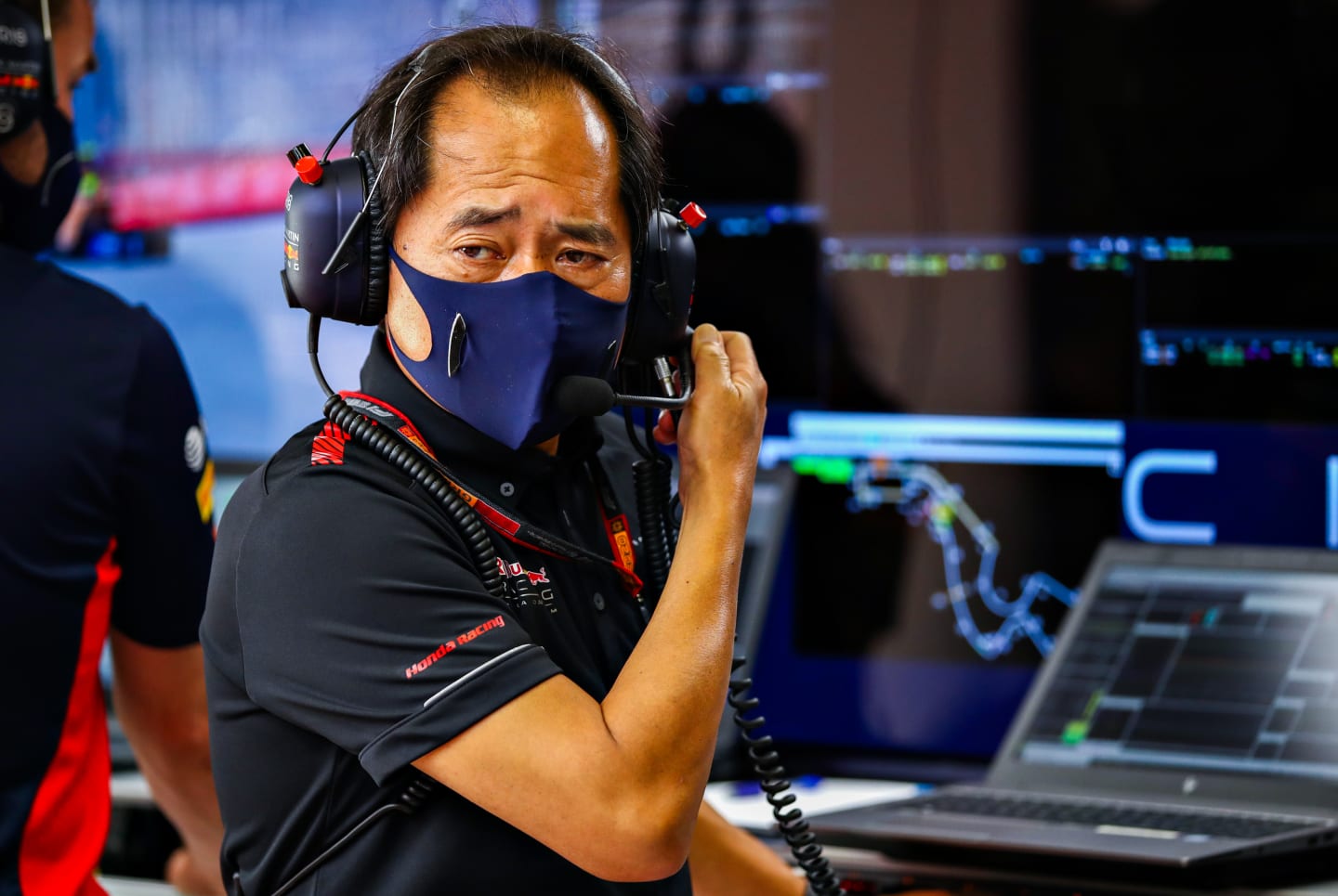 SOCHI, RUSSIA - SEPTEMBER 26: Toyoharu Tanabe of Honda looks on in the Red Bull Racing garage