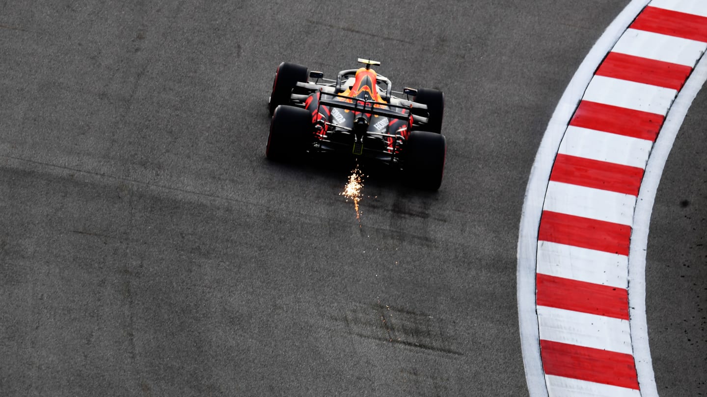 SOCHI, RUSSIA - SEPTEMBER 26: Sparks fly behind Alexander Albon of Thailand driving the (23) Aston Martin Red Bull Racing RB16 during qualifying ahead of the F1 Grand Prix of Russia at Sochi Autodrom on September 26, 2020 in Sochi, Russia. (Photo by Clive Mason - Formula 1/Formula 1 via Getty Images)