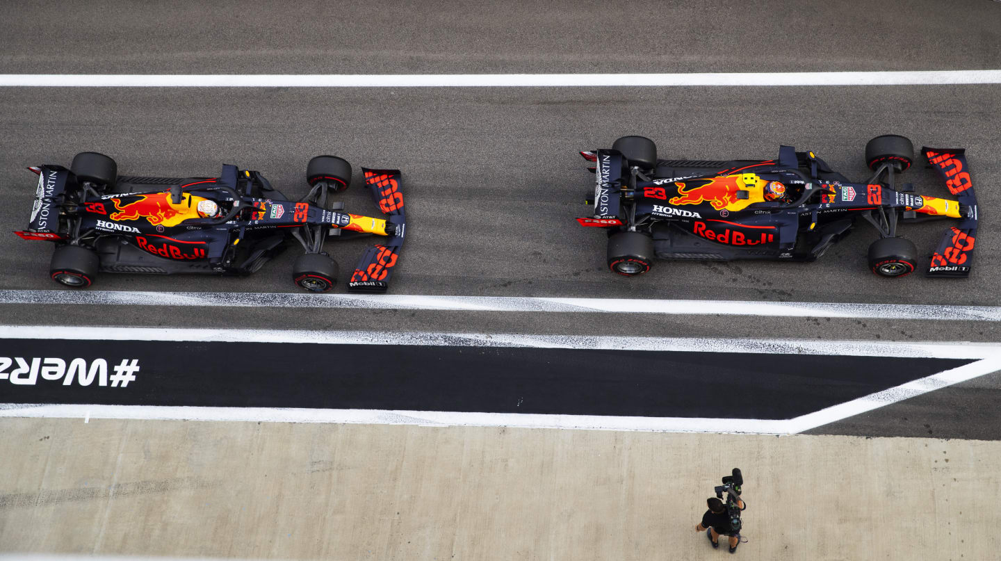 SOCHI, RUSSIA - SEPTEMBER 26: Alexander Albon of Thailand driving the (23) Aston Martin Red Bull Racing RB16 leads Max Verstappen of the Netherlands driving the (33) Aston Martin Red Bull Racing RB16 in the Pitlane during qualifying ahead of the F1 Grand Prix of Russia at Sochi Autodrom on September 26, 2020 in Sochi, Russia. (Photo by Mark Thompson/Getty Images)