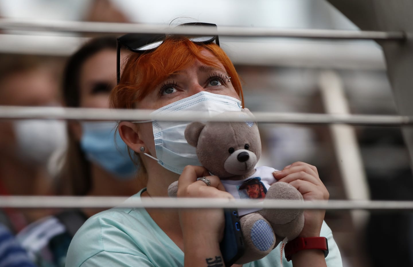 SOCHI, RUSSIA - SEPTEMBER 26: A fan holds a teddy bear as they watch the action during qualifying