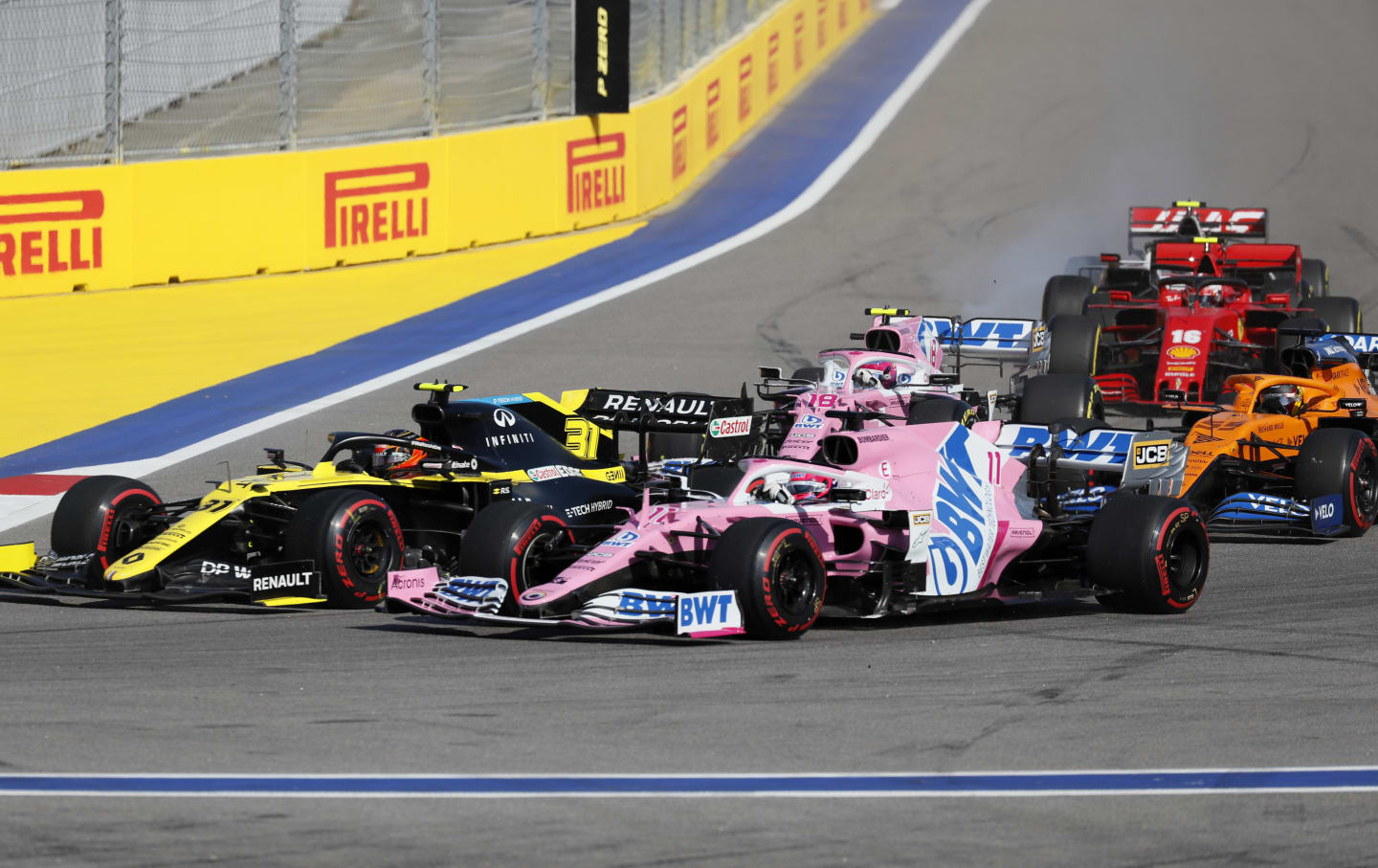 SOCHI, RUSSIA - SEPTEMBER 27: Esteban Ocon of France driving the (31) Renault Sport Formula One Team RS20 and Sergio Perez of Mexico driving the (11) Racing Point RP20 Mercedes on track during the F1 Grand Prix of Russia at Sochi Autodrom on September 27, 2020 in Sochi, Russia. (Photo by Yuri Kochetkov - Pool/Getty Images)