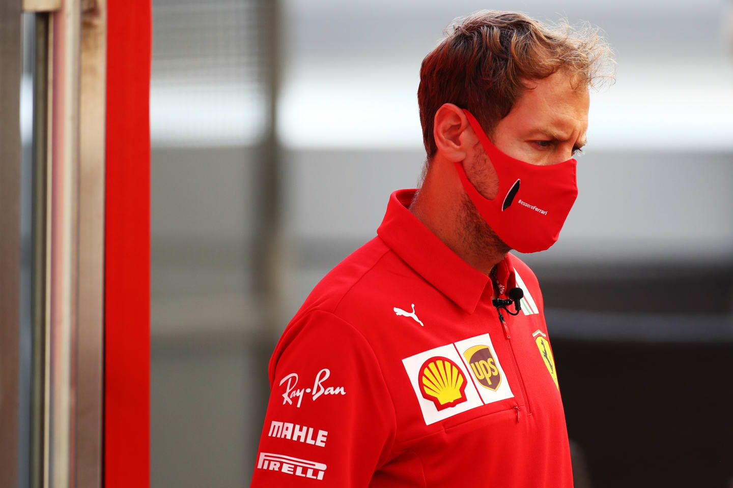 SOCHI, RUSSIA - SEPTEMBER 24: Sebastian Vettel of Germany and Ferrari looks on in the Paddock