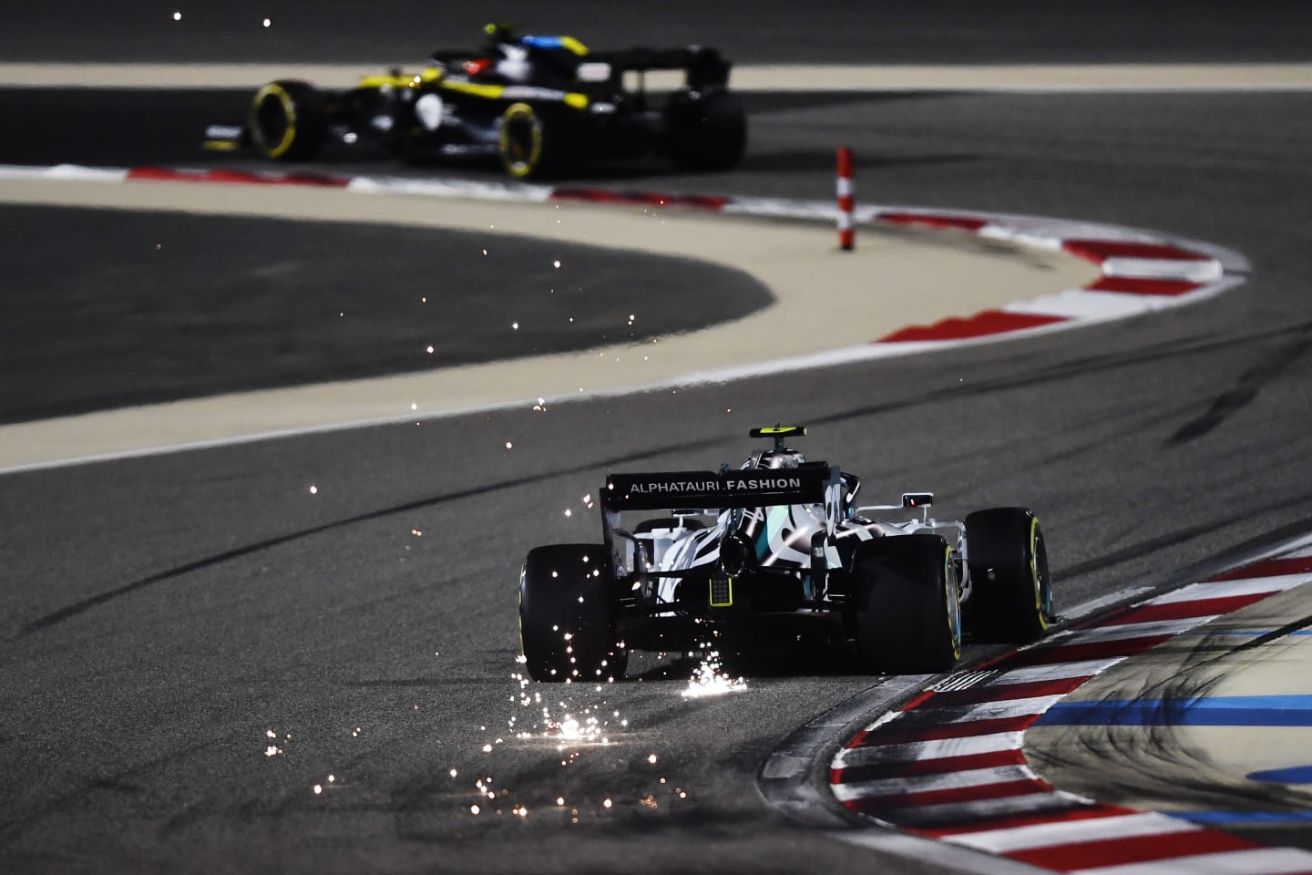 BAHRAIN, BAHRAIN - DECEMBER 04: Sparks fly behind Pierre Gasly of France driving the (10) Scuderia