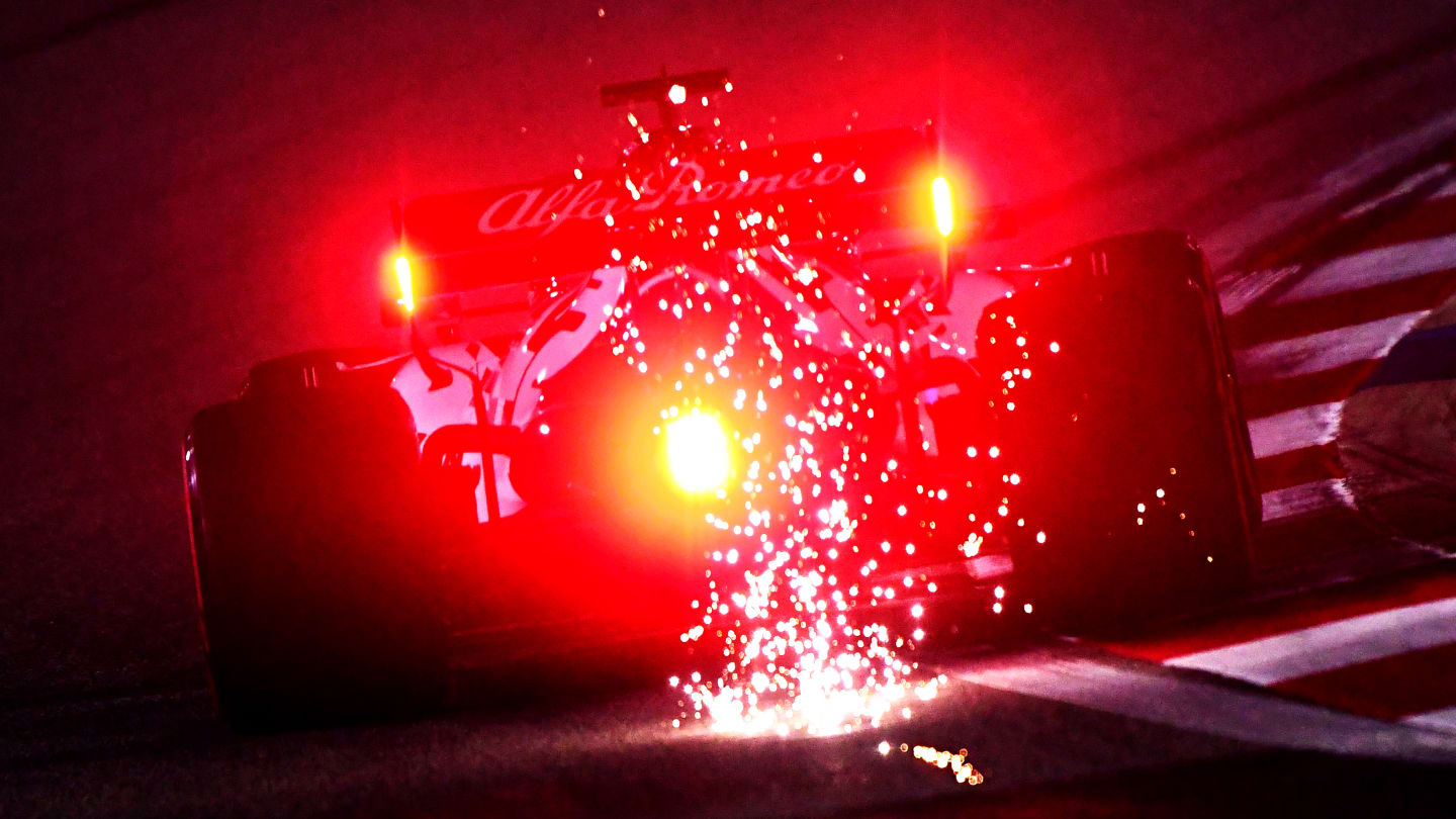 BAHRAIN, BAHRAIN - DECEMBER 04: Sparks fly behind Kimi Raikkonen of Finland driving the (7) Alfa Romeo Racing C39 Ferrari during practice ahead of the F1 Grand Prix of Sakhir at Bahrain International Circuit on December 04, 2020 in Bahrain, Bahrain. (Photo by Mario Renzi - Formula 1/Formula 1 via Getty Images)