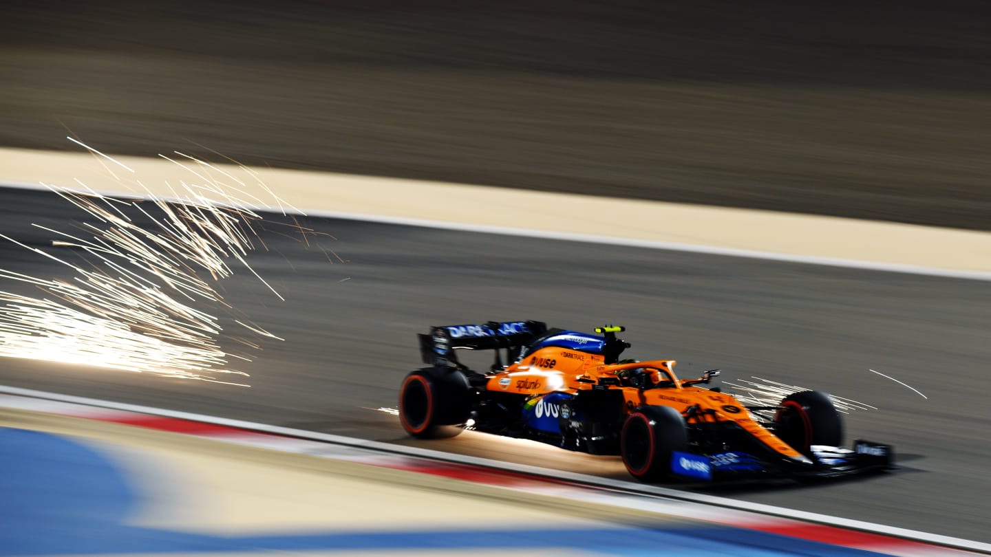 BAHRAIN, BAHRAIN - DECEMBER 05: Sparks fly behind Lando Norris of Great Britain driving the (4)