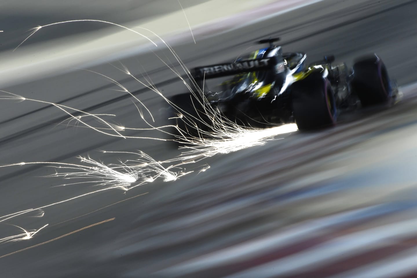 BAHRAIN, BAHRAIN - DECEMBER 05: Sparks fly behind Daniel Ricciardo of Australia driving the (3) Renault Sport Formula One Team RS20 during qualifying ahead of the F1 Grand Prix of Sakhir at Bahrain International Circuit on December 05, 2020 in Bahrain, Bahrain. (Photo by Rudy Carezzevoli/Getty Images)