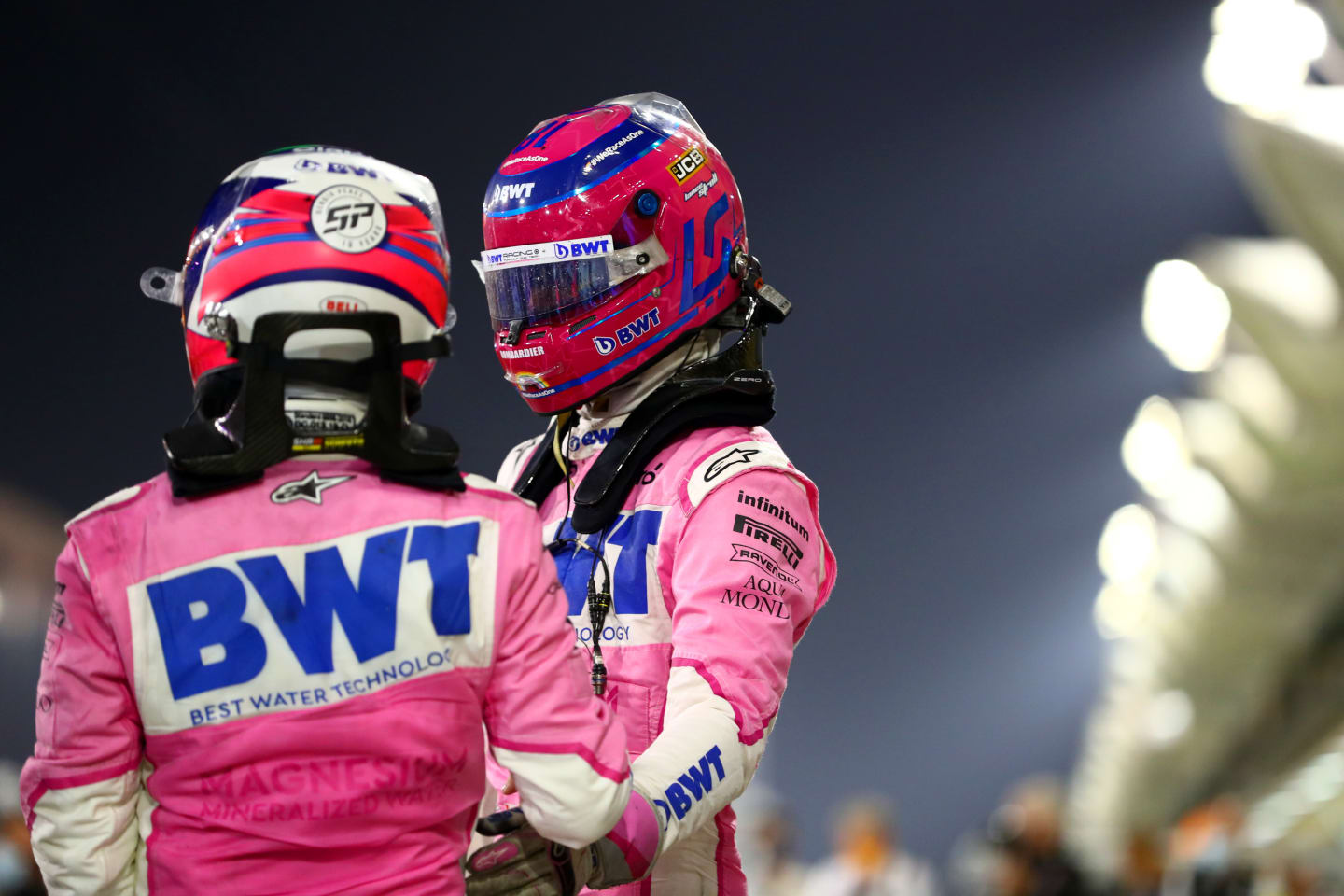 BAHRAIN, BAHRAIN - DECEMBER 06: Race winner Sergio Perez of Mexico and Racing Point and third placed Lance Stroll of Canada and Racing Point celebrate in parc ferme during the F1 Grand Prix of Sakhir at Bahrain International Circuit on December 06, 2020 in Bahrain, Bahrain. (Photo by Dan Istitene - Formula 1/Formula 1 via Getty Images)