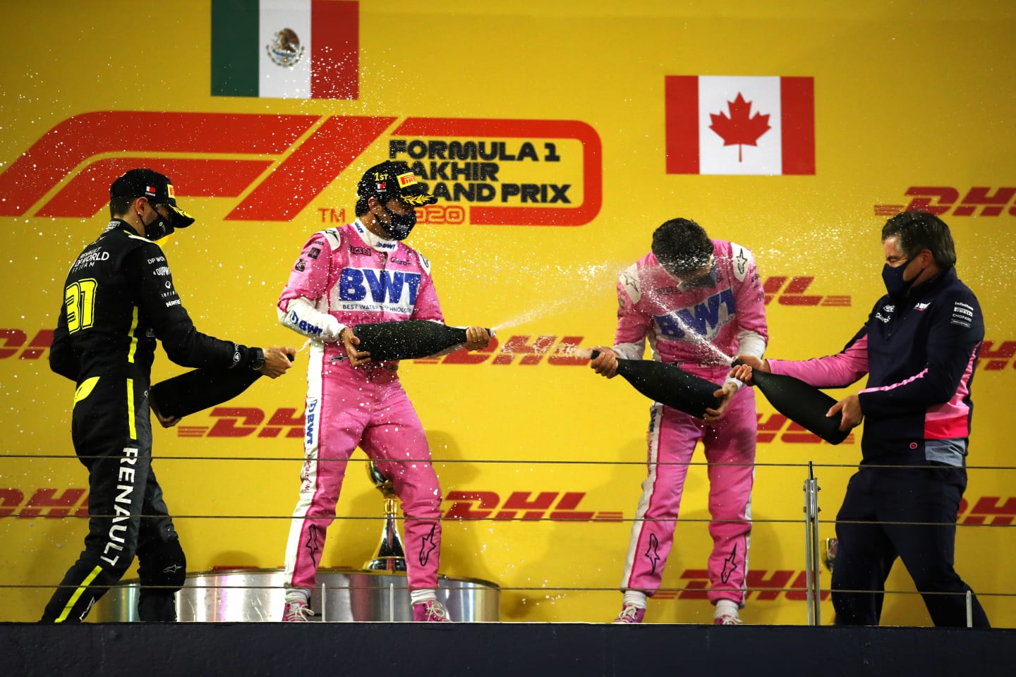 BAHRAIN, BAHRAIN - DECEMBER 06: Race winner Sergio Perez of Mexico and Racing Point, third placed