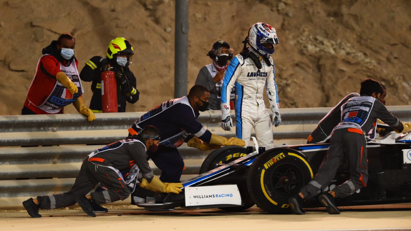 BAHRAIN, BAHRAIN - DECEMBER 06: Nicholas Latifi of Canada and Williams looks on as his car is taken away by track staff during the F1 Grand Prix of Sakhir at Bahrain International Circuit on December 06, 2020 in Bahrain, Bahrain. (Photo by Clive Mason - Formula 1/Formula 1 via Getty Images)