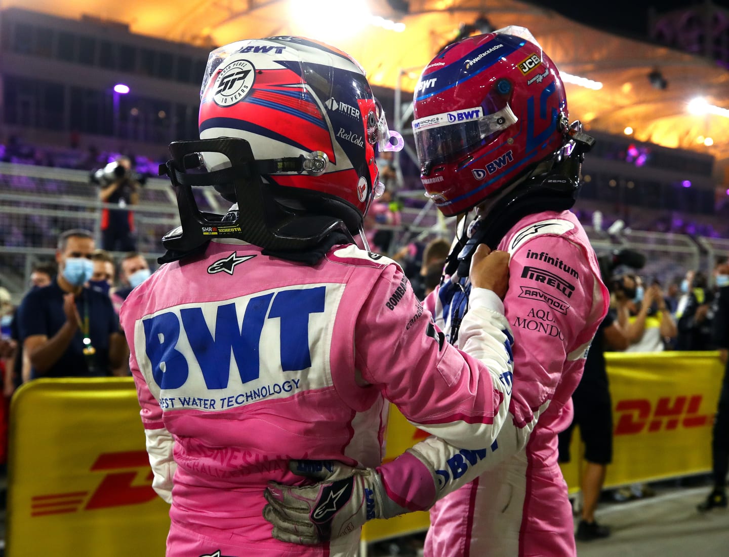 BAHRAIN, BAHRAIN - DECEMBER 06: Race winner Sergio Perez of Mexico and Racing Point and third placed Lance Stroll of Canada and Racing Point celebrate in parc ferme during the F1 Grand Prix of Sakhir at Bahrain International Circuit on December 06, 2020 in Bahrain, Bahrain. (Photo by Bryn Lennon/Getty Images)
